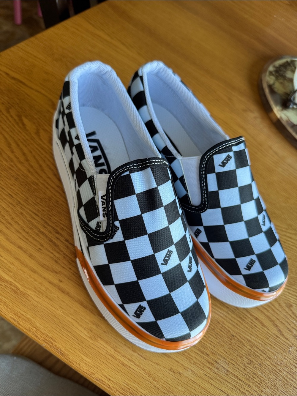 Vans Womens Checkerboard Slip-On in Black & White with Orange Trim. BRAND NEW